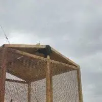 Steel mesh cage at an oilfield site